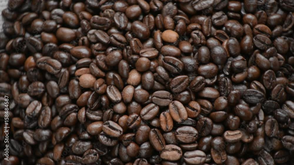 The coffee beans rotates on the turntable. The coffee beans rotates on the turntable.