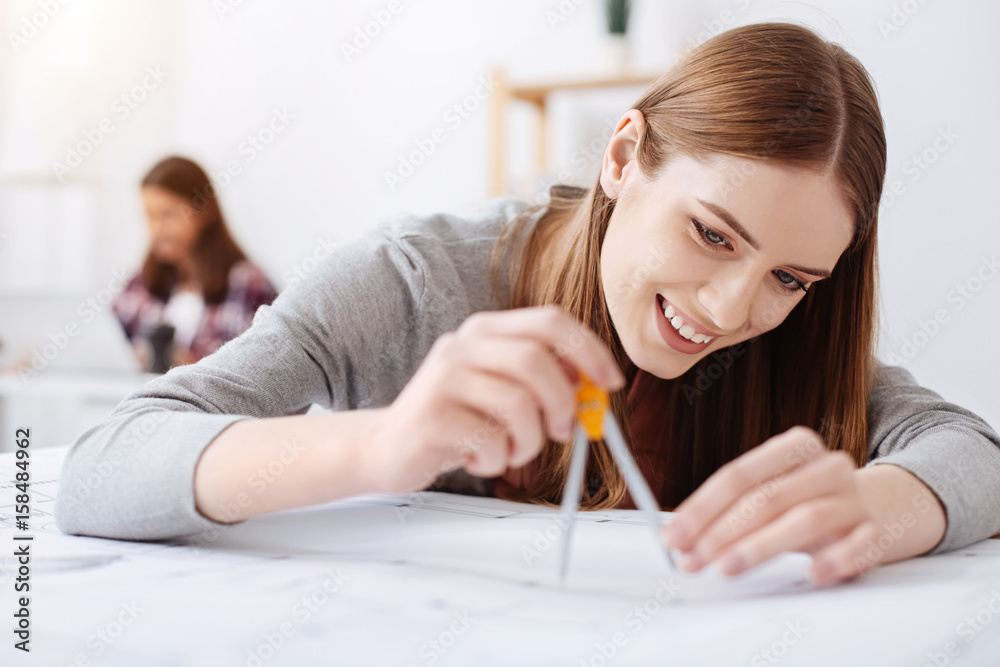 Gifted creative woman using a tool for measurements Gifted creative woman using a tool for measurements