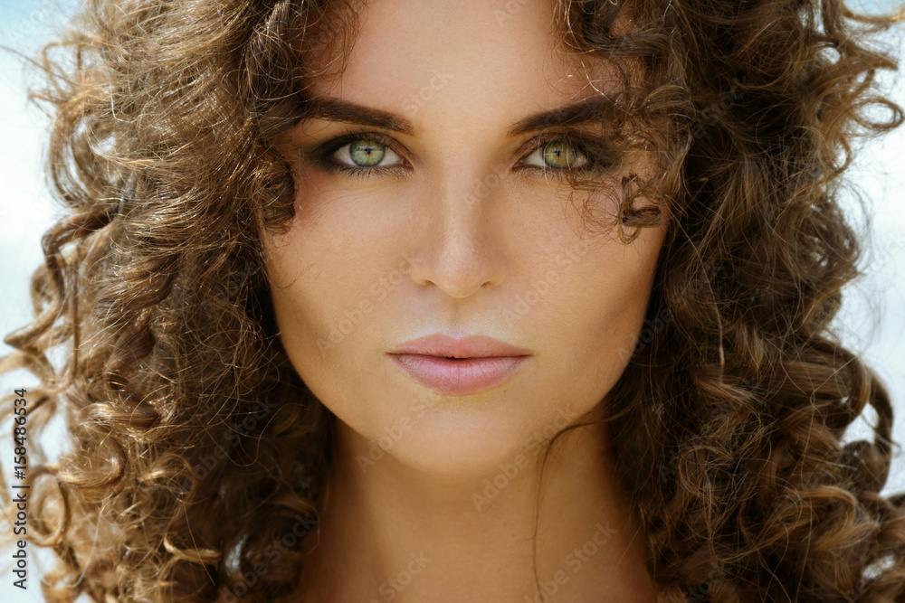 Beautiful woman with curly hair Beautiful woman with curly hair