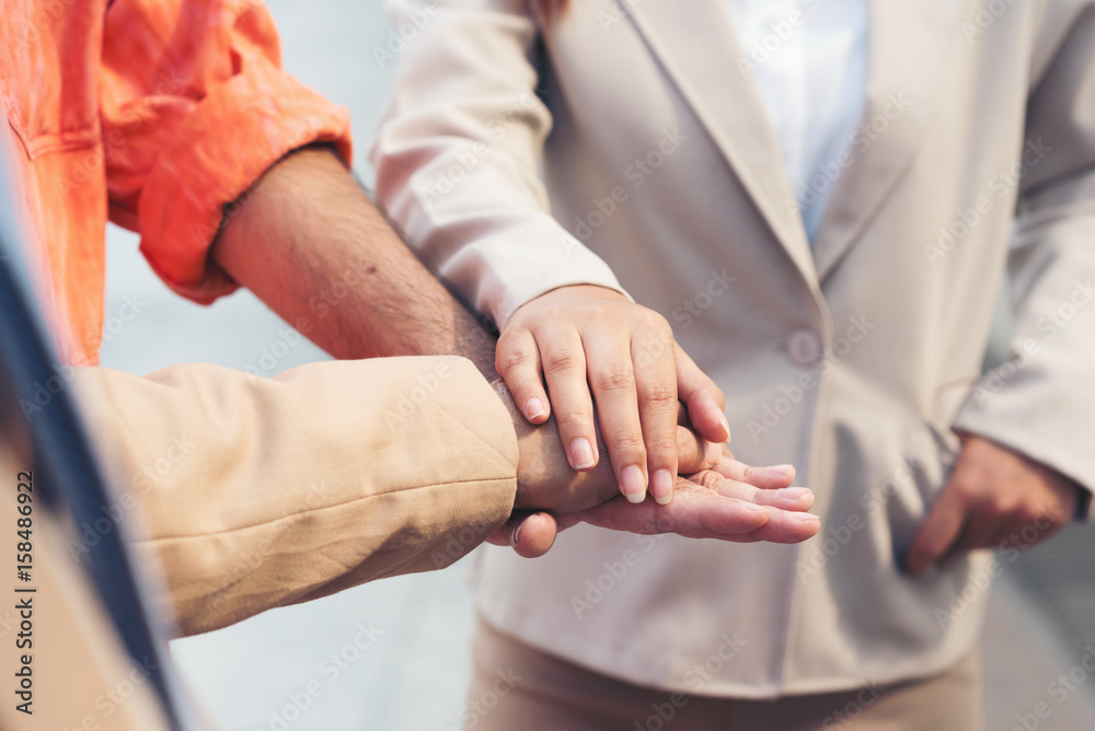 Business people joining hands.Stacking Hand,