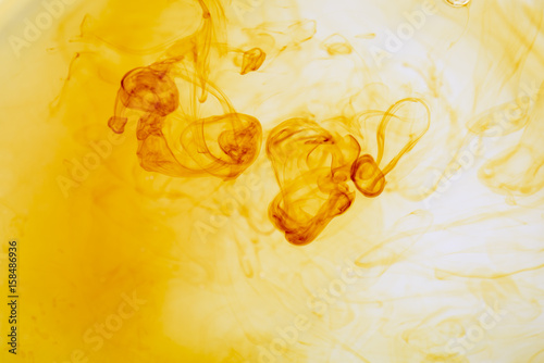 Iodine and water texture background. Abstract yellow swirling. Medical supplies