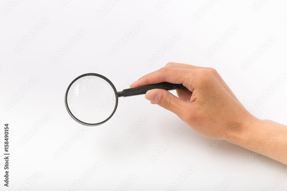 Female hands on white background with magnifier Female hands on white background with magnifier