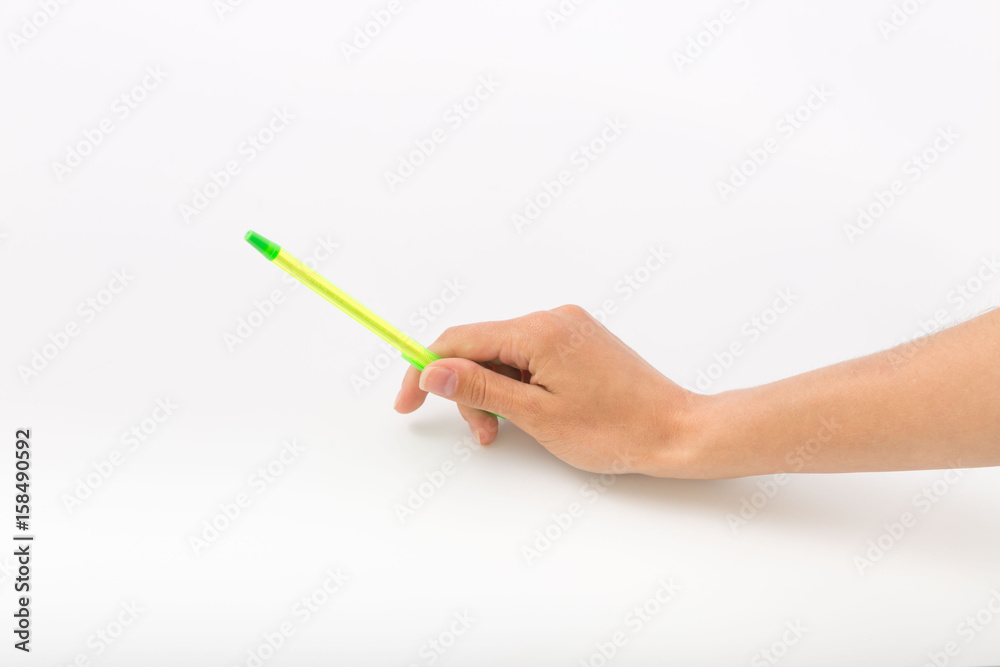 Female hands on a white background with a pen Female hands on a white background with a pen