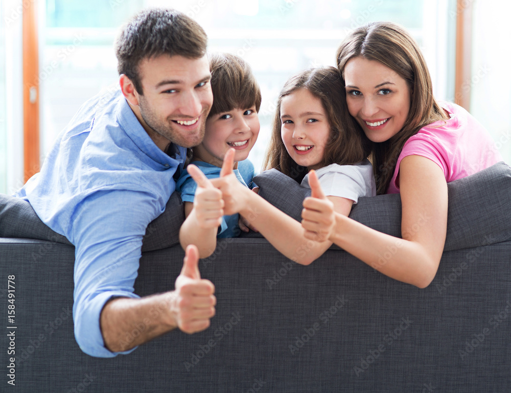 Fototapeta premium Family relaxing on sofa