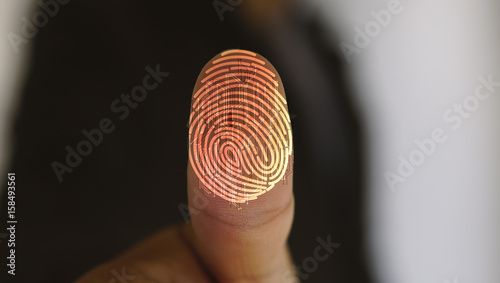 Businessman login with fingerprint scanning technology. fingerprint to identify personal, security system concept