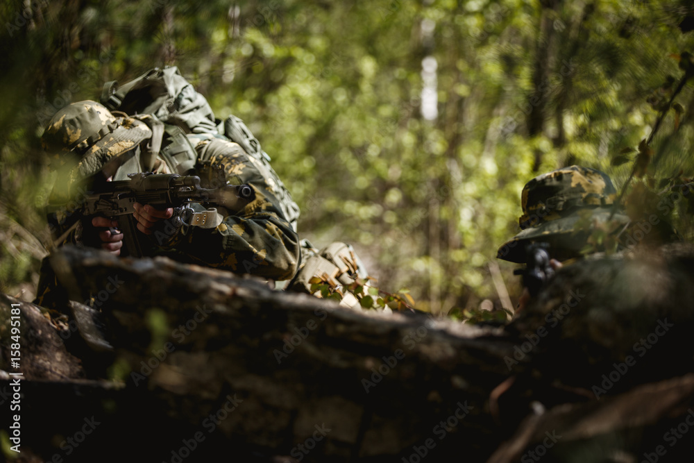 Fototapeta premium Military men with submachine gun