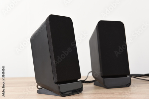speaker computer pace on wood desk background. photo