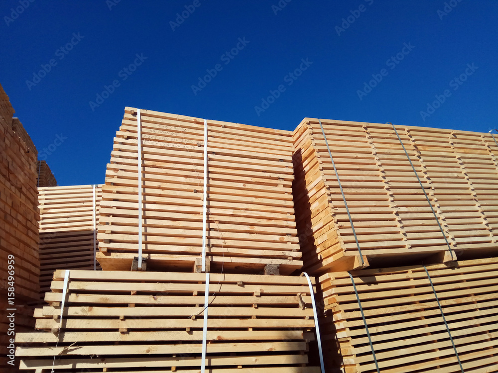 stack of wooden planks at the lumber yard stack of wooden planks at the lumber yard