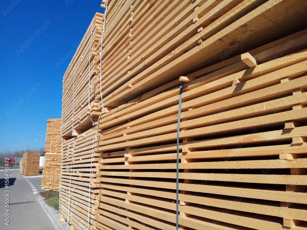 stack of wooden planks at the lumber yard stack of wooden planks at the lumber yard
