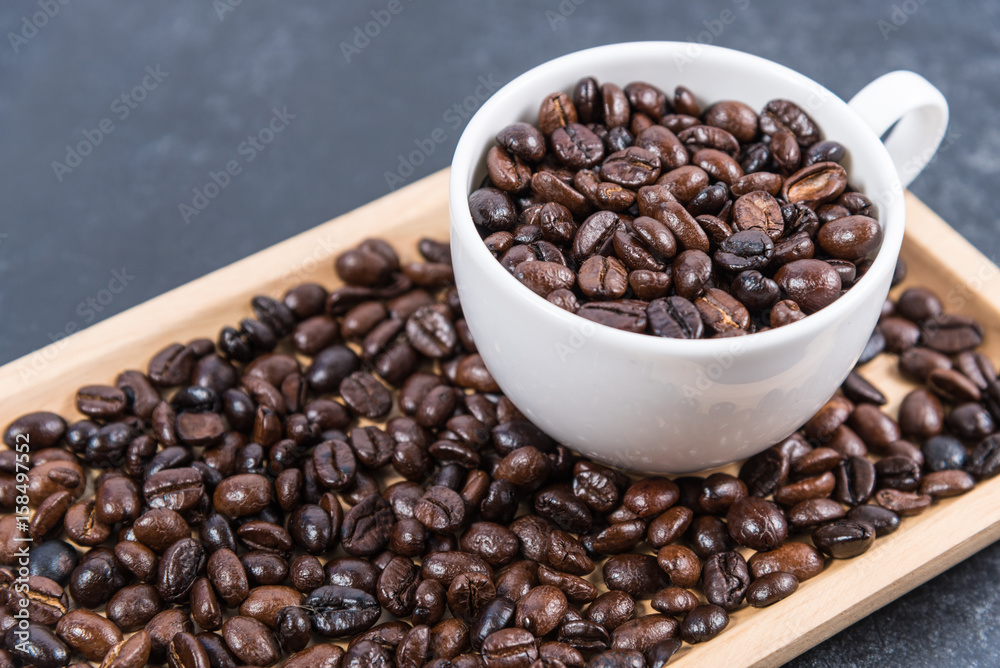 coffee cup and coffee beans on table coffee cup and coffee beans on table