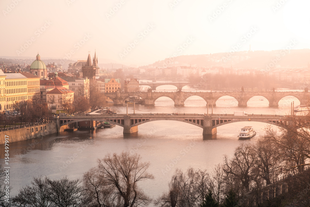 Prague bridges over Vltava river at sunset time, Czech Republic.