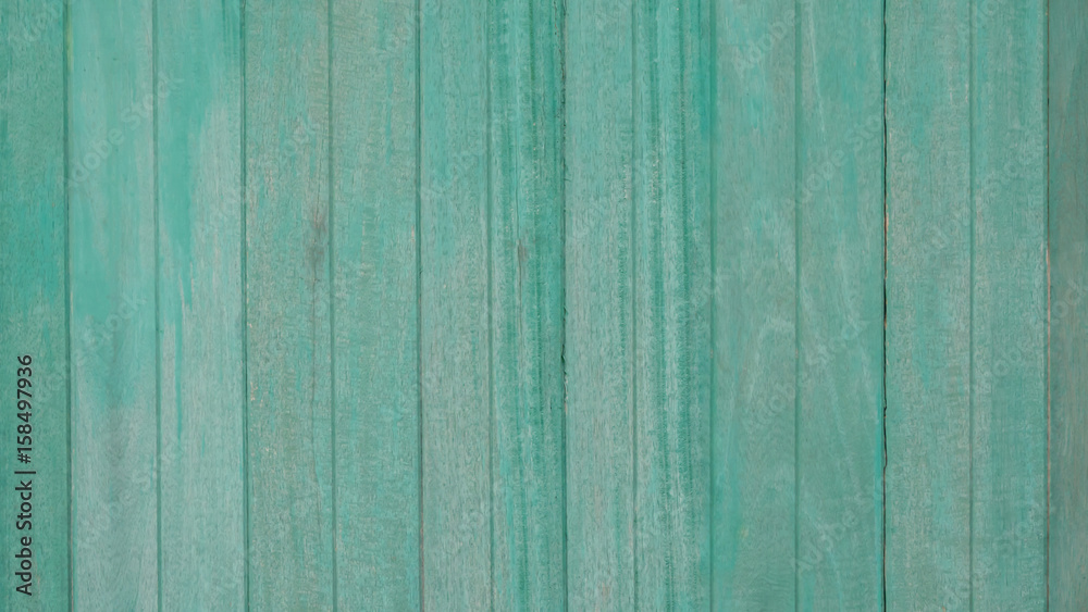 Wooden old fence, green background