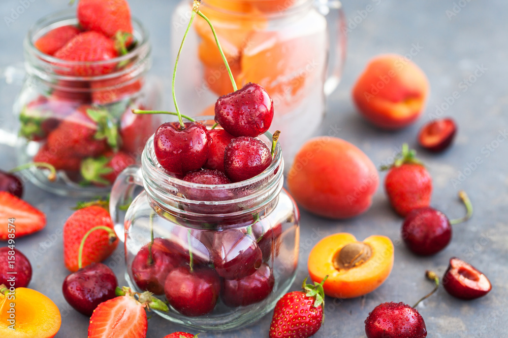 Fresh ripe summer cherry, strawberry and apricots Fresh ripe summer cherry, strawberry and apricots