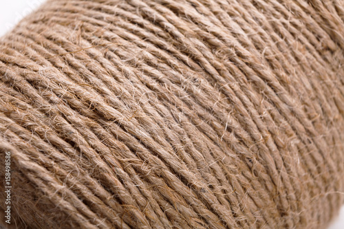 Coil of natural rope on white background