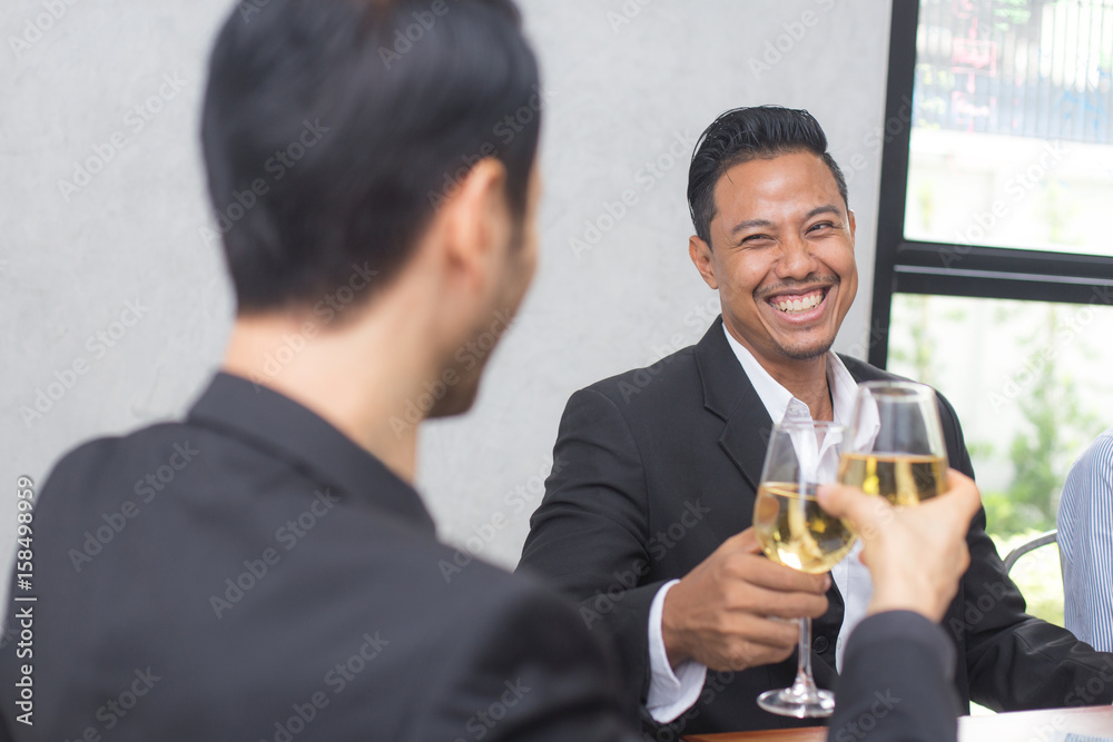 Young Business people drinking together, Business success concept, Greeting deal concept Young Business people drinking together, Business success concept, Greeting deal concept