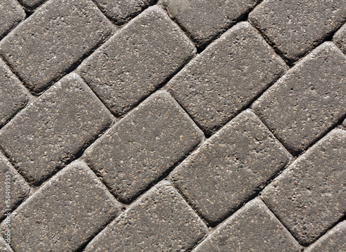 Gray color cobblestone pavement surface.