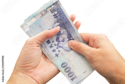Hands with Taiwan money on isolate white background.