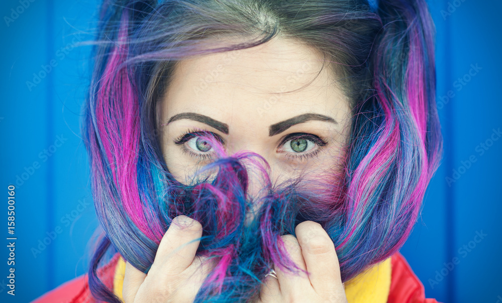 Portrait of beautiful fashion hipster woman with colorful hair