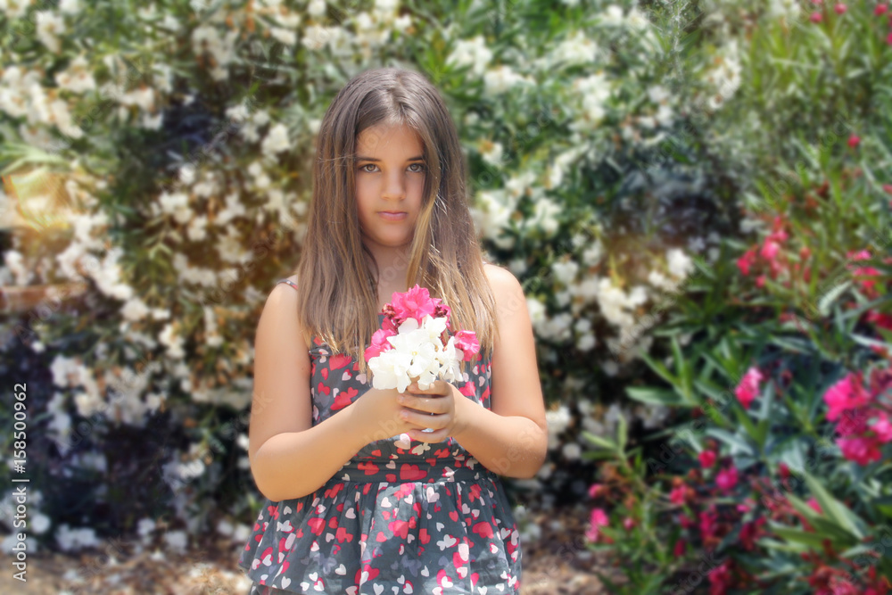 girl posing in the Park among the beautiful flowers girl posing in the Park among the beautiful flowers