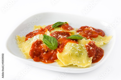 Ravioli with tomato sauce and basil isolated on white background 