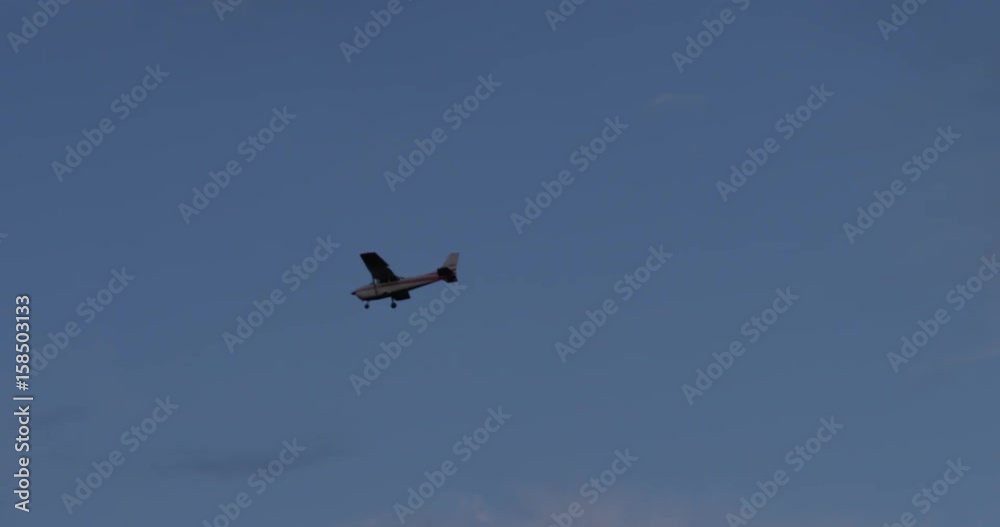 small prop plane flying through clouds in early morning small prop plane flying through clouds in early morning