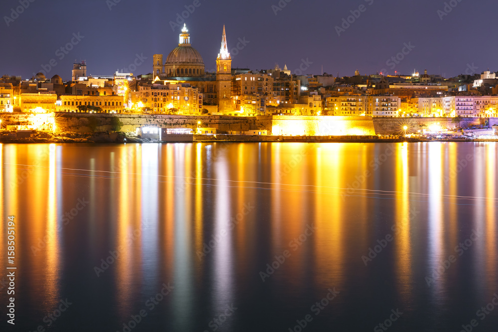 Valletta Skyline at night from Sliema with church of Our Lady of Mount Carmel and St. Paul's Anglican Pro-Cathedral, Valletta, Capital city of Malta
