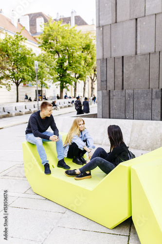 Photography Young people sitting on the lounge seats in Vienna