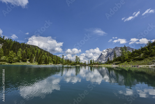 Zugspitze reflected in the crystal-clear waters of the turquoise lake Seebensee, Germany's highest mountain, view from Tyrol, Austria, Europe
