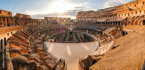 Panoramic view of Roman colosseum interior at sunset