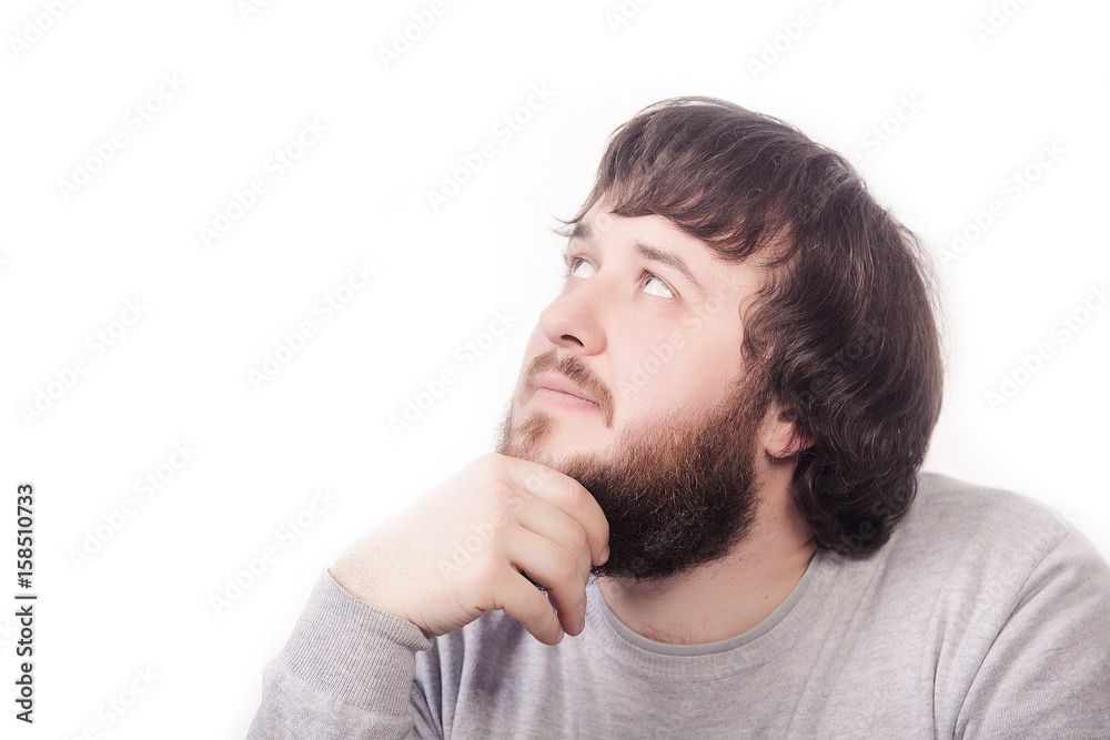 Happy dreaming young man with beard isolated on white background, close up Happy dreaming young man with beard isolated on white background, close up