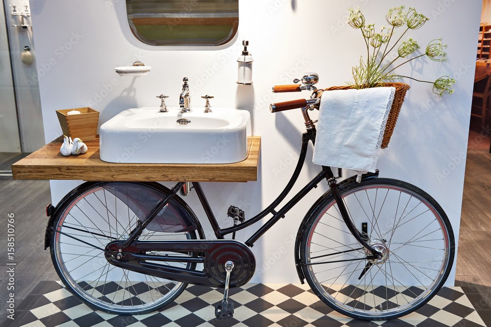 Washbasin and retro bicycle in bathroom Washbasin and retro bicycle in bathroom