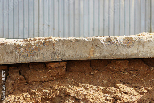 The concrete slab lies on a platform under a layer of sand. Different levels of. photo