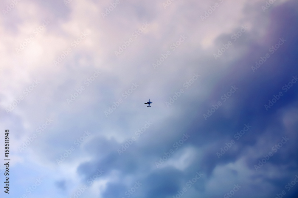 aeroplane flying in cloudy sky