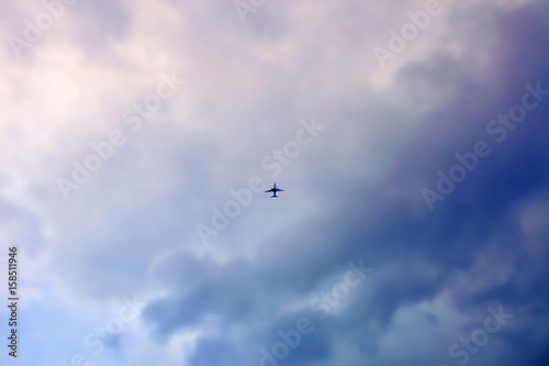 aeroplane flying in cloudy sky