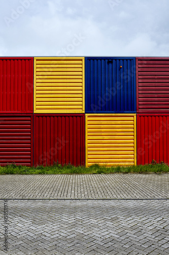Photography yellow and red cargo containers stapled