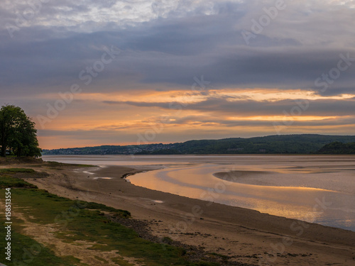 Beautiful early summer evening sunset over the beach and water at Arnside, Lancashire, UK