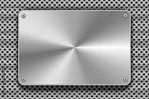 Polished metal plate with screws on grid, industrial background