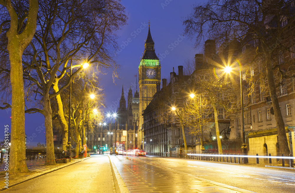 Fototapeta premium Traffic in Central London city, long exposure photo of red bus in motion
