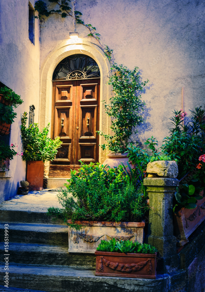 Entrance to the old Italian house at night.