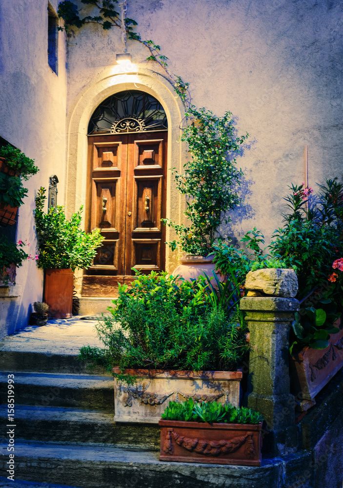 Fototapeta premium Entrance to the old Italian house at night.
