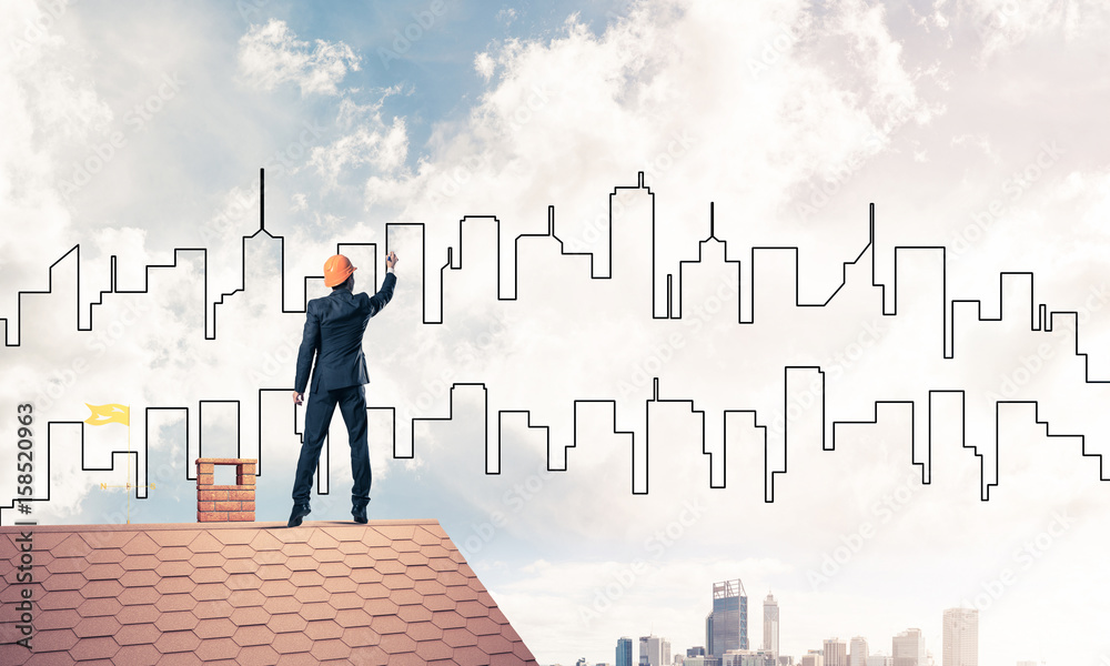 Man architect draw silhouette of modern city on blue sky. Mixed Man architect draw silhouette of modern city on blue sky. Mixed