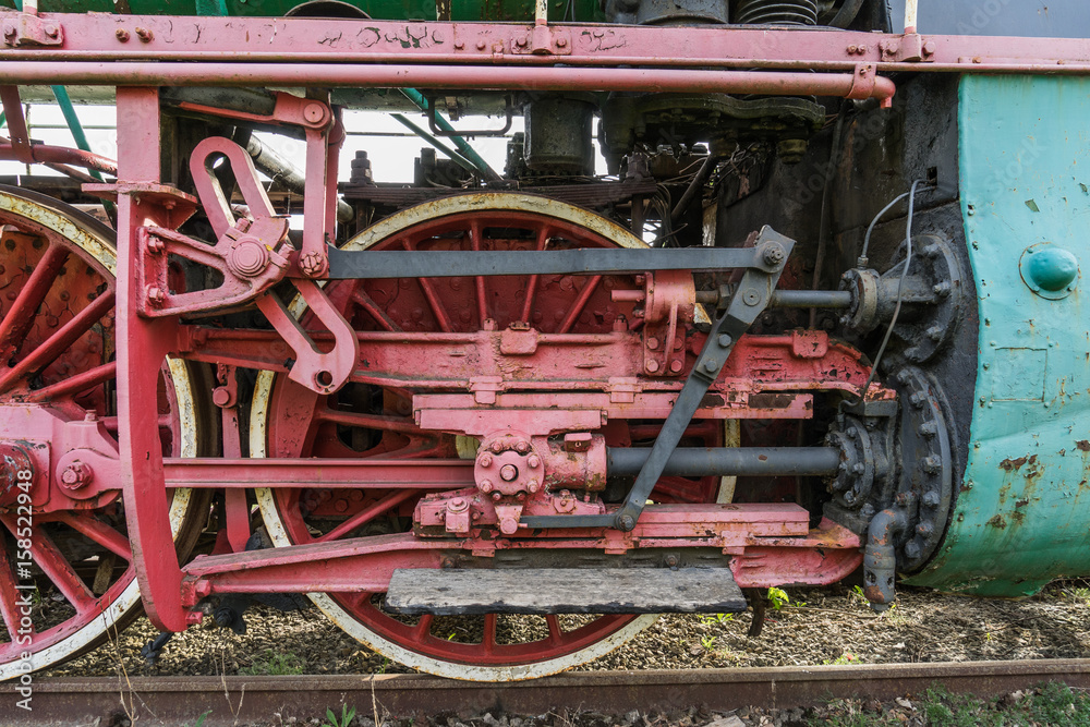 The transmission system locomotive traction on the huge metal wheels The transmission system locomotive traction on the huge metal wheels