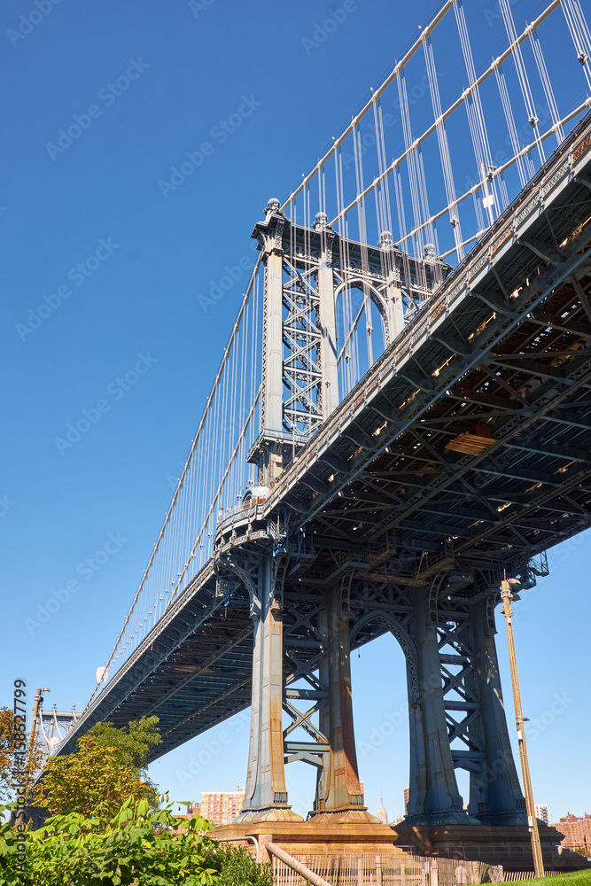 NEW YORK CITY - SEPTEMBER 25, 2016: Looking up under the Manhattan Bridge from Dumbo where it lands in Brooklyn