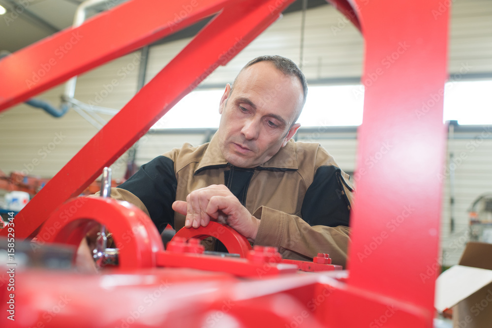 Engineer working on machinery Engineer working on machinery