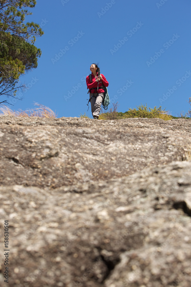 female climber walking on mountain