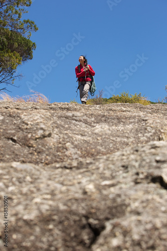 female climber walking on mountain