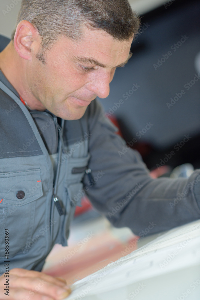 Closeup of workman concentrating Closeup of workman concentrating