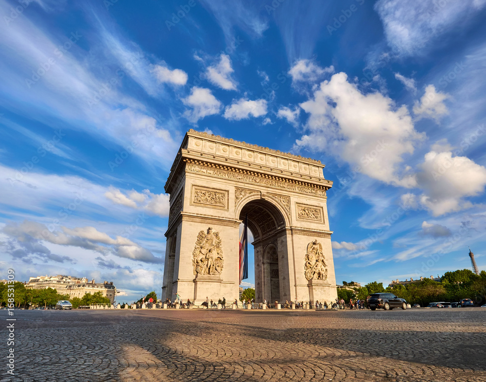 Arc de Triumph in Paris, France, on a bright afternoon Arc de Triumph in Paris, France, on a bright afternoon