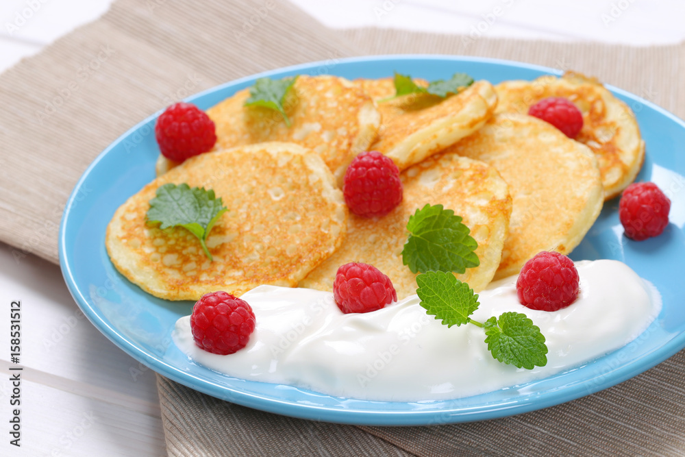 american pancakes with yogurt and raspberries