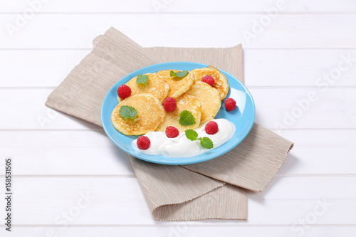 american pancakes with yogurt and raspberries